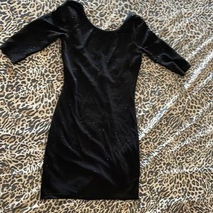 Lovely day black sparkly mini dress with scoop neck in back. 3/4 length sleeve